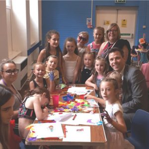 Children and a member of staff from the Maesycwmmer Summer Play Scheme with Chris Evans MP and Community Councillors Anthony Joynes and Maureen Harries